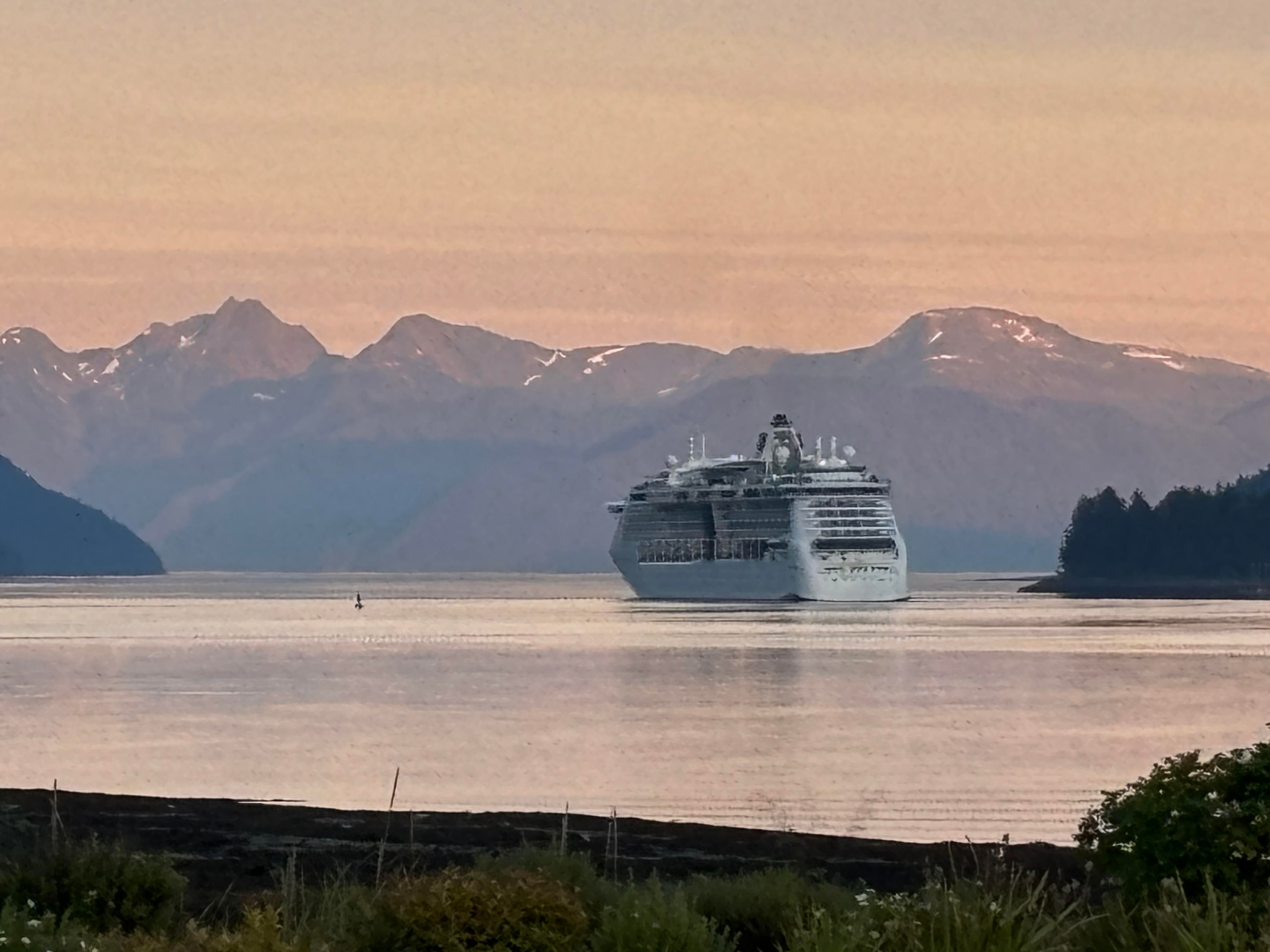 Cruise ship anchored in Alaskan mountains